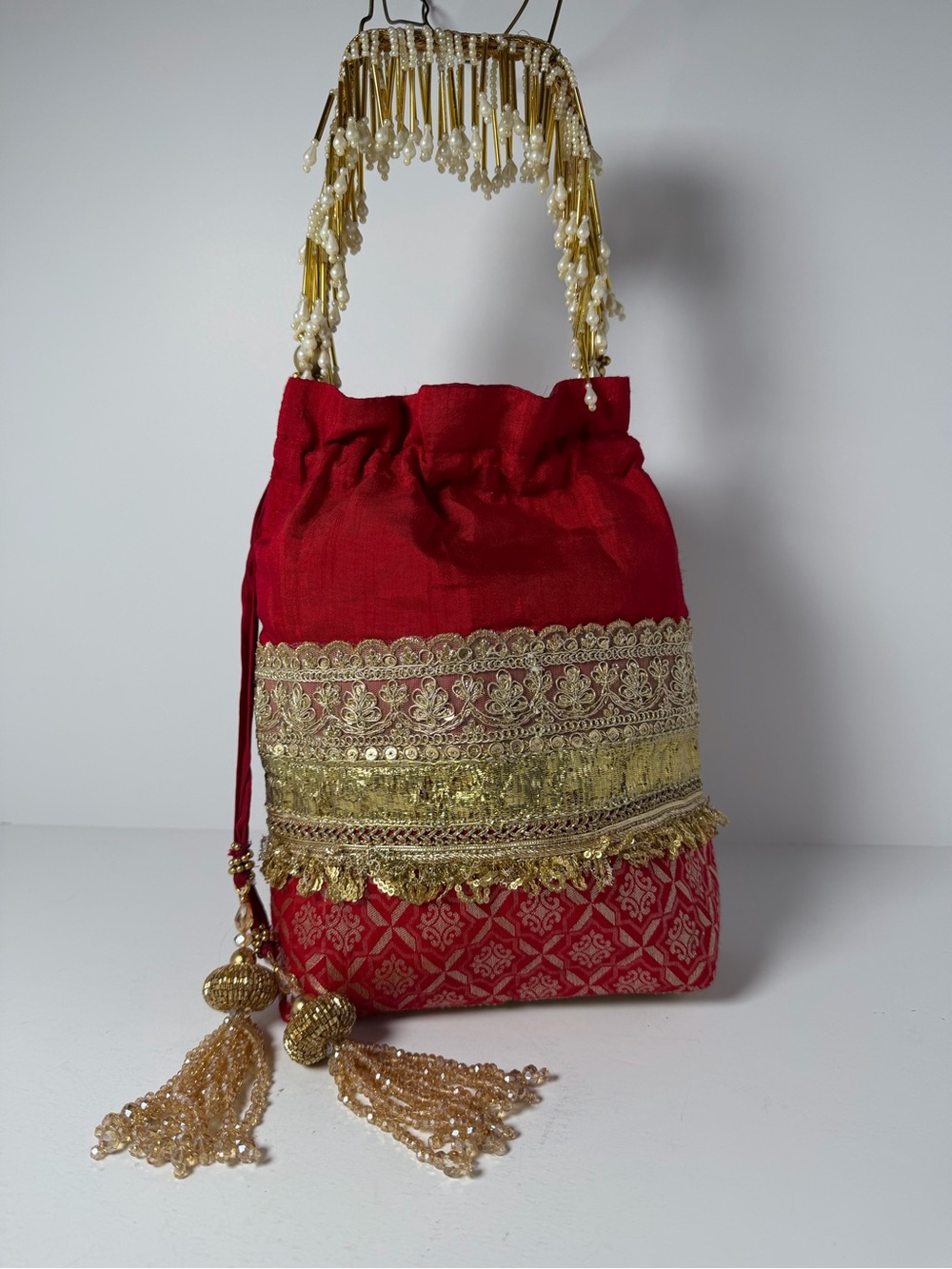 Vibrant Red & Gold Embroidered Potli Bag | Pearl Handle & Beaded‎ Tassels